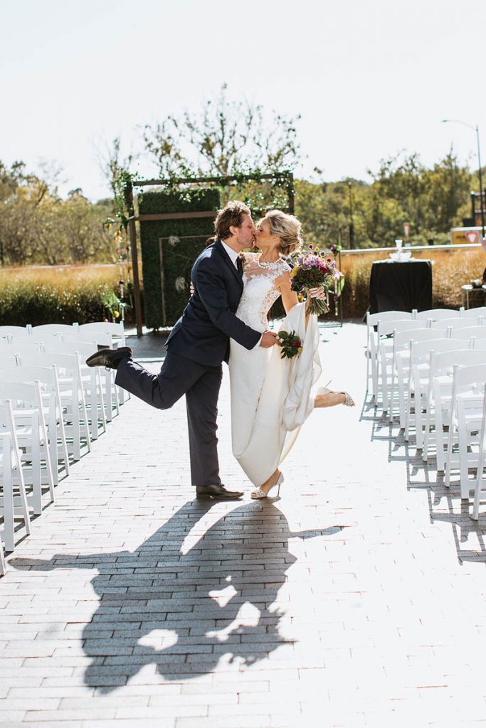 Kari and Ryan kissing at their wedding