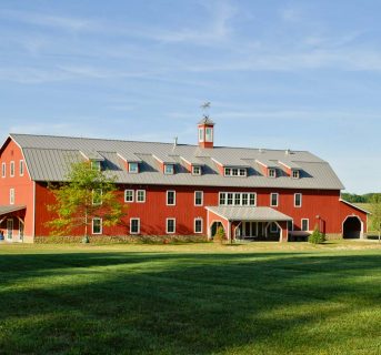 Large red barn / stable building