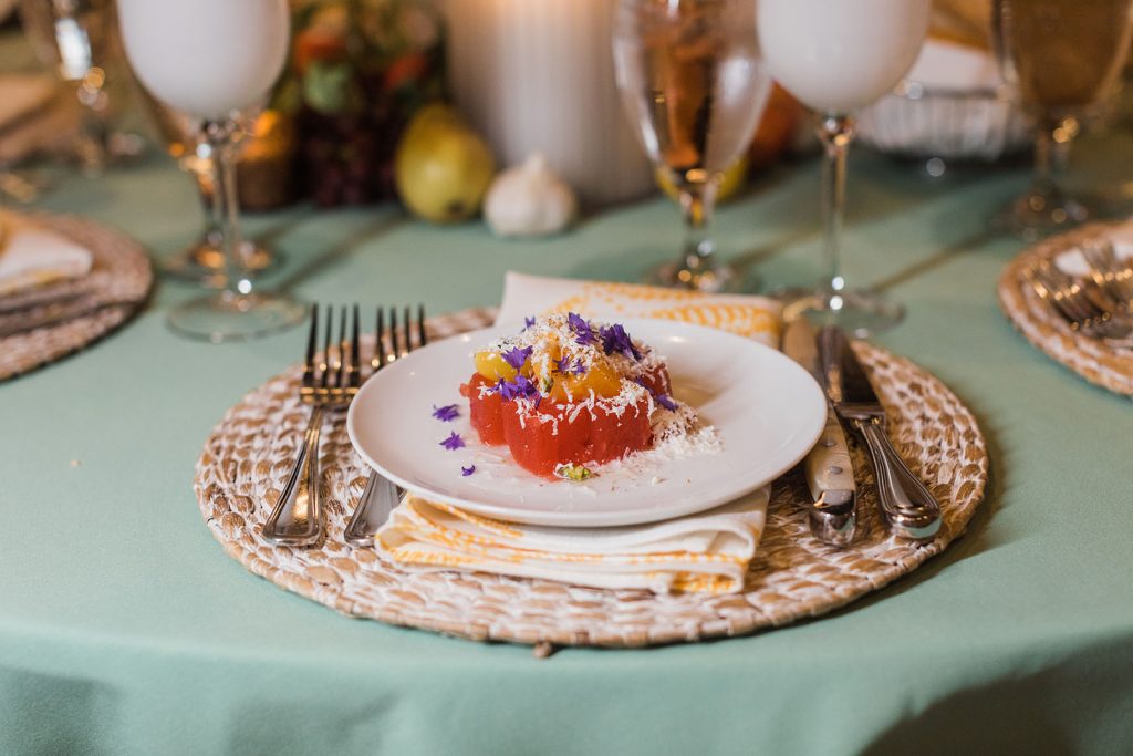 Heirloom Tomato and Watermelon Salad on a farmhouse place setting.